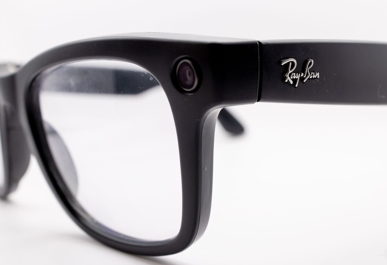 The Art of Drawing Readers In: Your attractive post title goes here Detailed close-up shot of black smart glasses featuring a built-in camera, highlighting modern technology and design.
